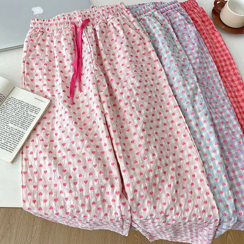 Comfortable home-style heart-printed pajama pants 2025 new casual family pants. The pink pants can be worn as a coat