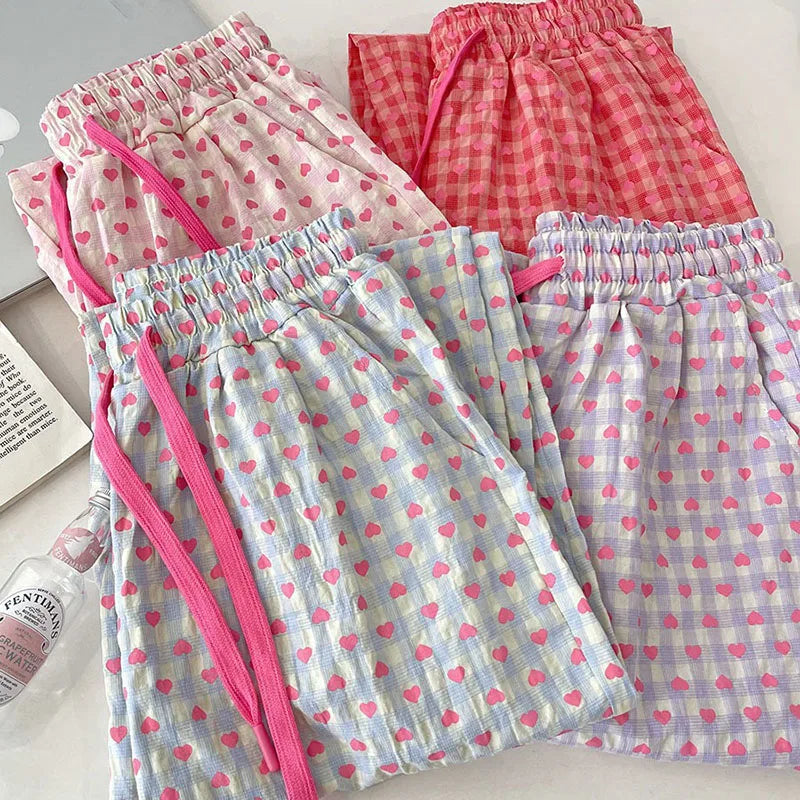 Comfortable home-style heart-printed pajama pants 2025 new casual family pants. The pink pants can be worn as a coat